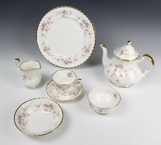 A Royal Albert Victoriana Rose tea/dinner service comprising 8 tea cups, 8 saucers, milk jug, sugar bowl and teapot, 8 small plates, 6 medium plates, 8 dinner plates, 1 sandwich plate, 8 dessert bowls