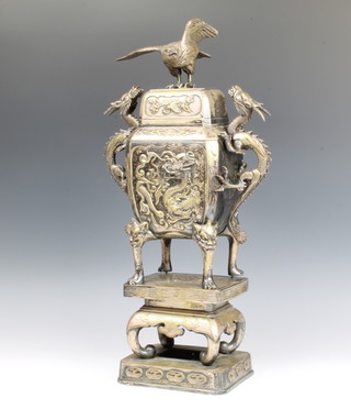 A Chinese bronze Koro cover and stand, the finial in the form of an eagle with twin dragon handles, the body decorated with dragons and flowers, raised on a floral stand, now ex plated, 55cm 