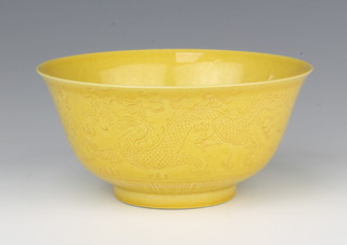 An 18th Century style Jiaqing yellow ground bowl with incised dragons and 4 character mark to the base 14cm 