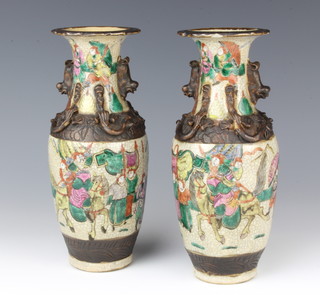 A pair of Chinese crackle glazed oviform vases decorated with warriors 24cm 
