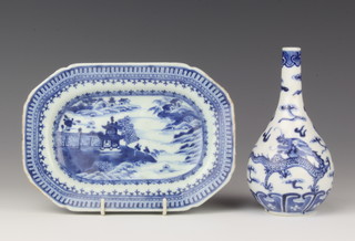 An 18th Century Chinese blue and white octagonal stand decorated with a landscape view 19cm together with a Chinese blue and white bottle vase decorated with a dragon 15cm 