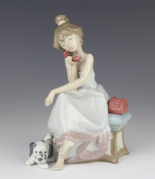 A Lladro figure of a lady using a telephone with a Dalmatian at her feet 5466 20cm 