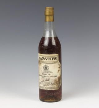 A bottle of Harveys Grande Champagne Cognac vintage 1893, bottled in 1969 