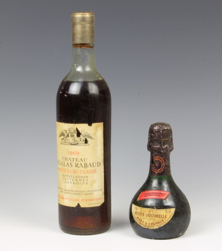 A bottle of 1969 Chateau Sigalas Rabaud together with a bottle of Moet Chandon petite liqueur  