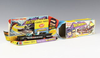A Corgi Toys no.267 rocket firing Batmobile gloss black with red bat hubs (no tow hook), complete with backdrop, boxed 