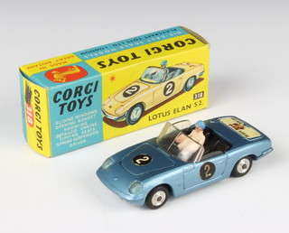 A Corgi Toys no. 318 Lotus Elan S2 in metallic blue complete with figure, boxed. Rear decal "I've got a Tiger in my tank" and No 2 decals to both side doors and bonnet. Includes Corgi Model club subscription leaflet