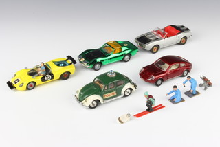 A Corgi Toys 344 Ferrari 206 Dino in yellow complete with 2 members of pit team, a Corgi 343 Pontiac Firebird, a 387 Corgi Chevrolet Corvette Stingray Coupe, a Corgi 492 Volkswagen 1200 European Police car in green and a Corgi 341 Mini Marcos GT 850, all unboxed together with a miniature pair of golf clubs, a figure of a skier and a figure of a racing driver 
