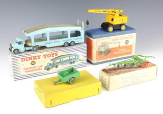 A Dinky Toys no.982 Car Transporter boxed, a Dinky no.571 Coles mobile crane boxed, a Britain's 138F four furrow tractor plough boxed and a Dinky trailer 