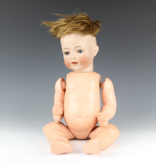 A Simon and Halbig, a 19th Century German porcelain doll with open and shutting eyes, open mouth with 2 teeth, head incised Simon Halbig 1397, Made in Germany 48cm 