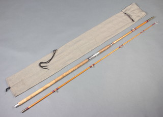 A Pegley Davies 2 piece 11' split cane beach casting fishing rod contained in a cloth bag  