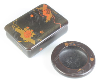 A Japanese rectangular black lacquered and floral decorated trinket box 3cm x 12cm x 9cm (slight chips to lid in places) and a ditto circular dish 1cm x 8cm diam. 