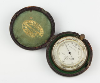 A Negretti and Zambra pocket barometer, the silvered dial marked 28625 contained in a leather carrying case 