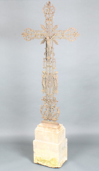 A 19th Century French cast iron crucifix raised on a carved stone base 189cm h x 74cm w 