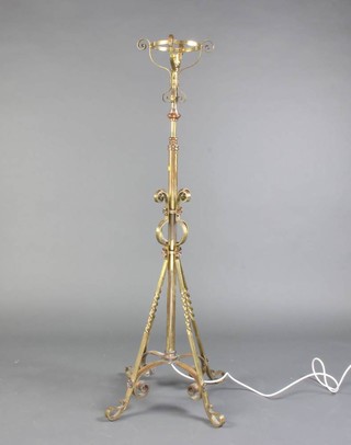 A 19th Century gilt metal adjustable oil lamp stand converted to an electric table lamp, raised on outswept supports (reservoir missing) 134cm x 54cm diam. 