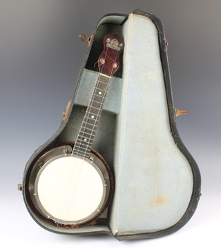 A George Formby 4 stringed ukulele banjo and case, the head marked B/1662 