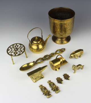 A Benares brass goblet shaped jardiniere 14cm x 12cm, a miniature brass kettle and trivet, do. coal scuttle, anvil, model pig, dog, etc 