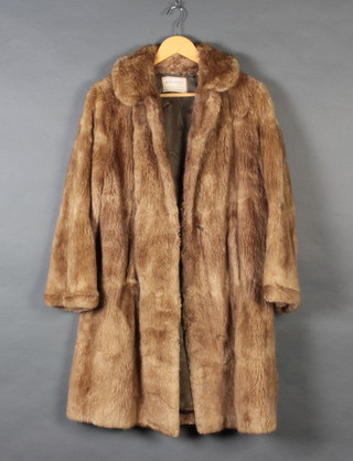 A lady's light fur coat by David Jackson Ltd Eastbourne and Worthing 