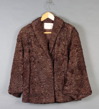 A lady's quarter length Persian lamb coat by William and Hutchins Ltd 8 Hanover Square 
