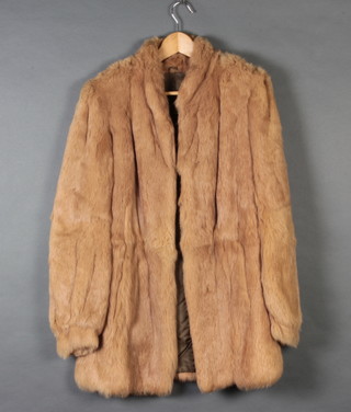 A lady's three quarter length light fur coat by Polo Norte, size 12 