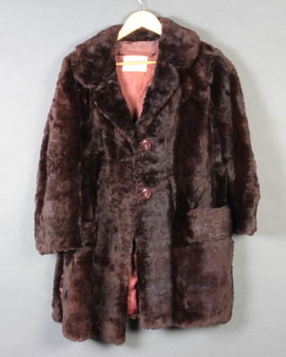 A lady's 2 button, three quarter length brown fur coat by Adukin of Brighton 