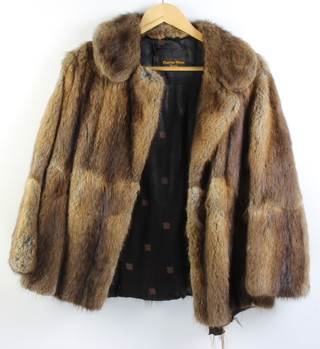 A lady's short mink fur jacket by Charles Moss (lining frayed) together with a lady's white quarter length fur coat