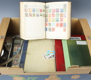 A Wanderer stamp album of used world stamps, 3 stock books of world stamps and a collection of mint and used world stamps