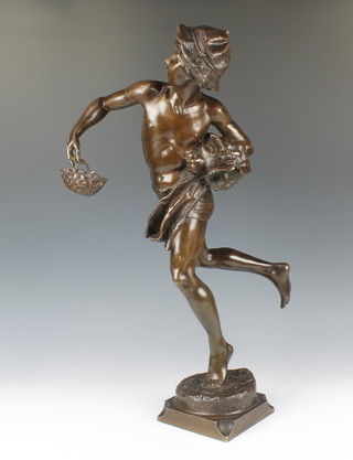After Guillaune, a bronze figure of a standing boy carrying a basket, raised on a square base 58cm 