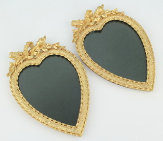 A pair of polished gilt metal heart shaped easel photograph frames with garland decoration 18cm x 12cm