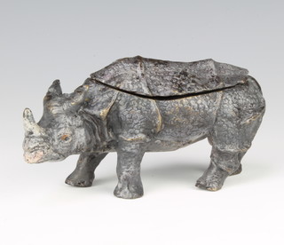 A bronze cold painted inkwell in the form of a walking rhino 8cm h x 19cm x 6cm d 