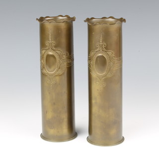 A pair of Trench Art vases formed from 3lb shell cases, the base marked 53, 20cm h 