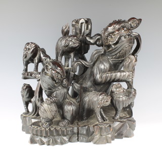 A large and impressive Chinese hardwood figure group of Dogs of Fo set with hardstone eyes 37cm x 39cm x 40cm 