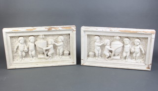 A pair of deeply carved and painted Victorian wooden panels decorated cherubs 51cm h x x 91cm w x 10cm d 