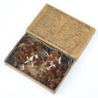 An early Hardy cardboard box containing a collection of 1920's fishing flies
