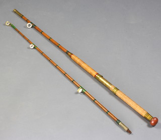 A vintage 2 piece cane boat fishing rod with ceramic eyes