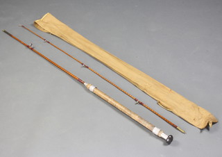 A split cane 8' fishing rod with agate lined rings and original cloth bag 
