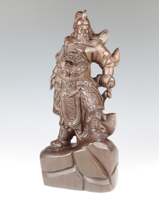 A Chinese carved hardwood figure of a standing warrior 40cm x 17cm x 10cm 