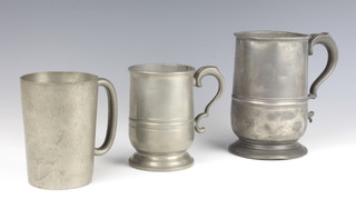A 19th Century pewter quart tankard marked X, a crown and rose pewter pint tankard and a George V LCC pewter pint tankard (dent to base) 