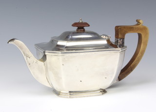 A silver octagonal teapot with fruitwood handle and knop, Sheffield 1936, gross weight 652 grams gross 