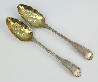 A pair of George III Irish silver berry spoons with chased armorials Dublin 1792, 158 grams, maker JS 