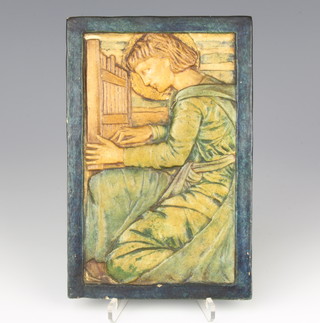A Compton Pottery tile plaque of a kneeling figure with impressed mark 19cm x 12cm 
