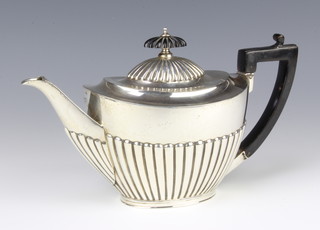 A Victorian silver demi-fluted teapot with ebony mounts Sheffield 1896,maker Roberts & Belk gross weight 484 grams 