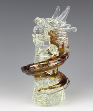 A 20th Century glass sculpture in the form of a dragon with a ball in his mouth 25cm 