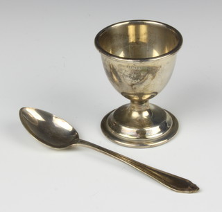 A silver egg cup and spoon, 35 grams 