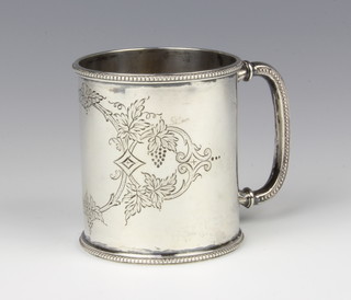 A Victorian silver mug with chased decoration and vacant cartouche, Sheffield 1880, 7cm,maker Fenton Bros 82 grams