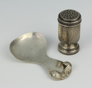 A silver caddy spoon with feather handle, London 1990 8cm and a silver pepperette 45 grams