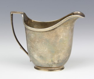 A George III silver helmet shaped cream jug with chased armorial London 1803, 9cm, 115 grams 