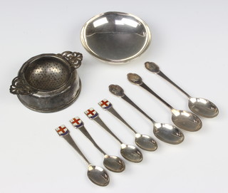 A circular silver shallow dish London 1935, a tea strainer and stand, minor spoons, 222 grams 