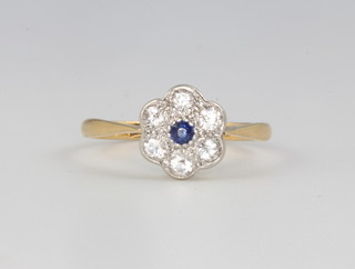An 18ct yellow gold diamond and sapphire cluster daisy ring size M, 1.7 grams