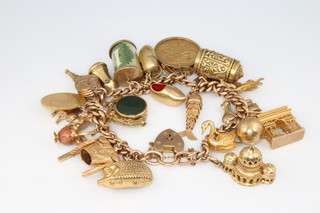A 9ct yellow gold charm bracelet including an 1886 sovereign and an 1895 half pond, gross weight 84 grams