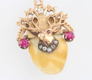 An American yellow gold enamelled fraternity jewel set with garnets and paste stones